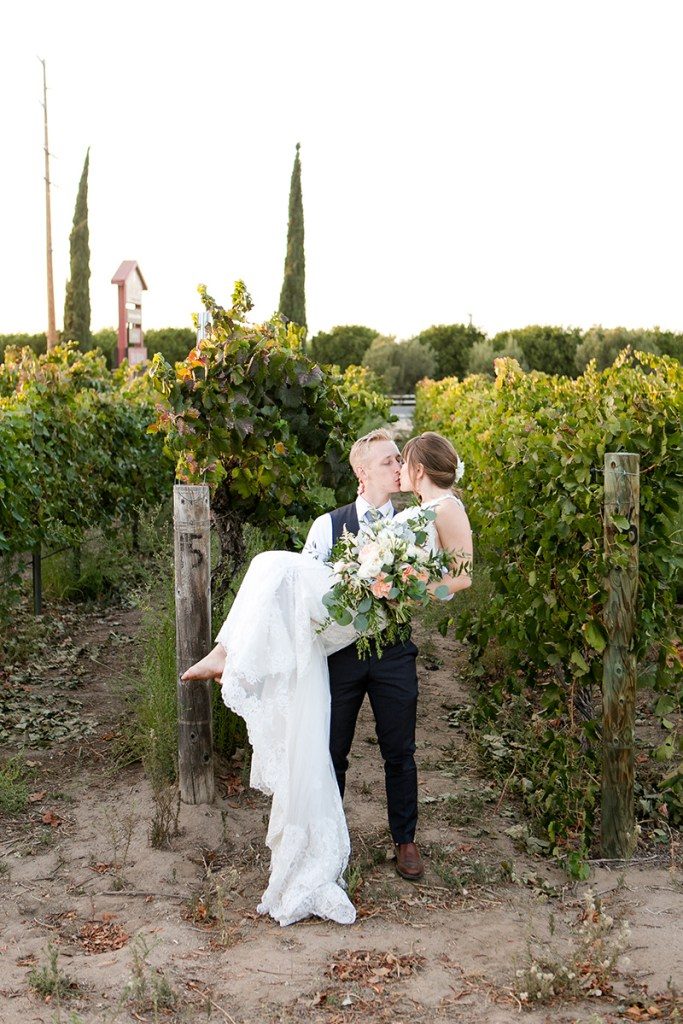 Wedding dress by Danelle's Bridal Boutique | Photo by Leah Marie Photography // Irena & Colby's California winery wedding